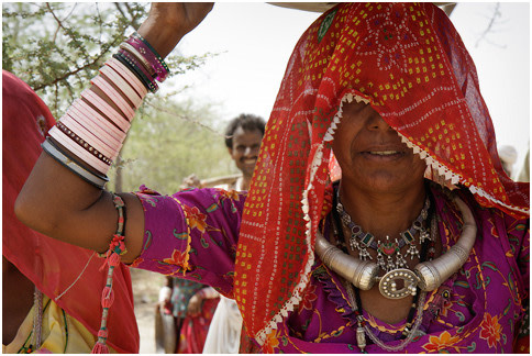 Veiled woman with silver ornaments