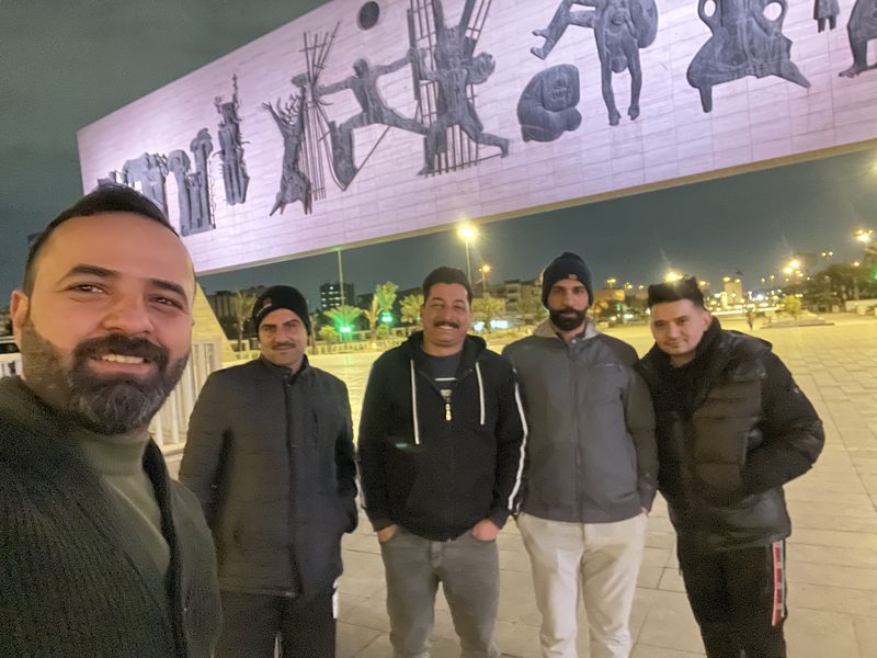Ali Babylon with tour guests in Baghdad
