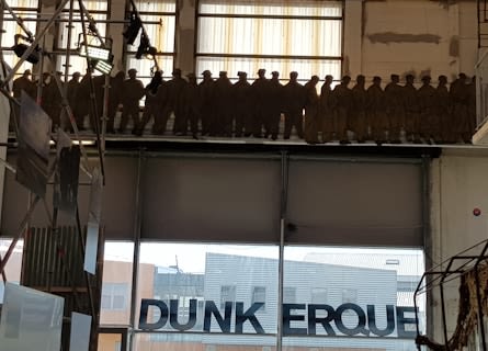 Image title Silhouettes of soldiers queuing on the beach