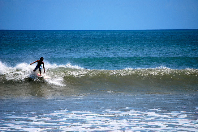 Surfer at Kuta Beach in Bali