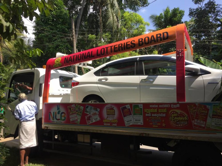 Lottery trucks parading down highways and side streets alike