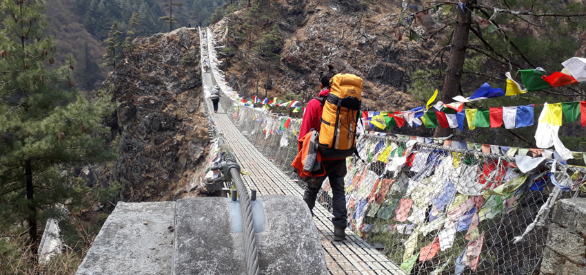 Trekkers carrying luggage in Gokyo Lake Trek