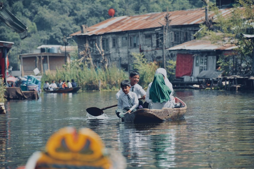 Children going to school on a Shikara