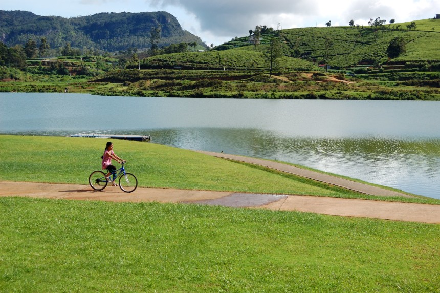 Girl on a bicycle near the lake