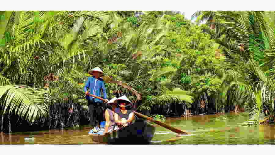 Beautiful canal of Cai Be with rowing boat