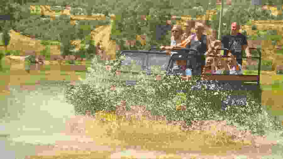 Travellers in a jeep