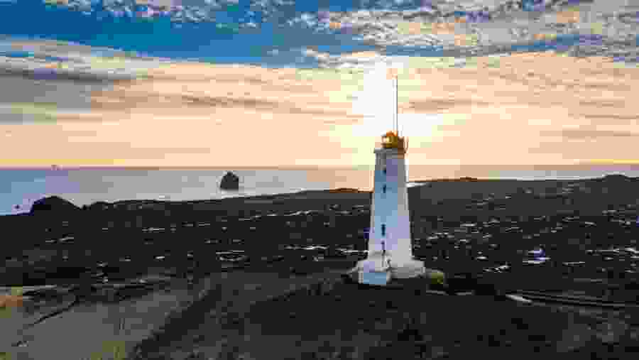Reykjanes Lighthouse standing proudly on the rugged coastline, offering stunning sea views