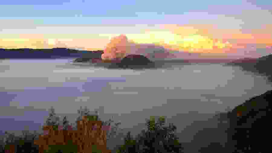 Mount Bromo is shrouded in mist in the morning during sunrise