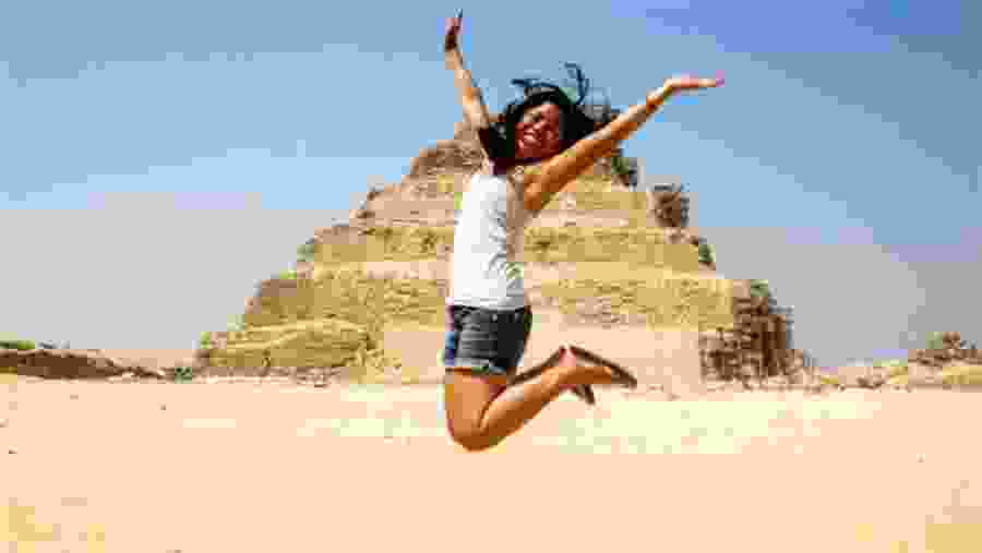 Travelers next to the pyramids