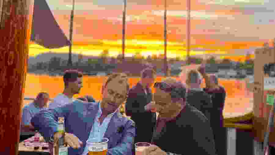 Travellers enjoying food and drinks at Oslofjord Cruise