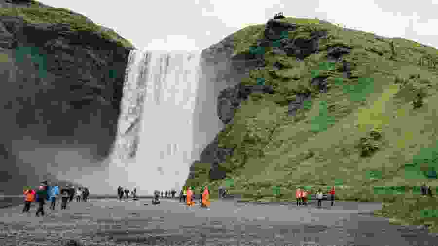 Skógafoss waterfall thundering down its cliffside, an experience not quickly forgotten!
