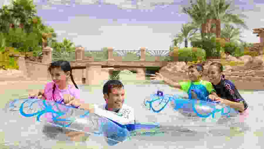 Happy tourists in the pool