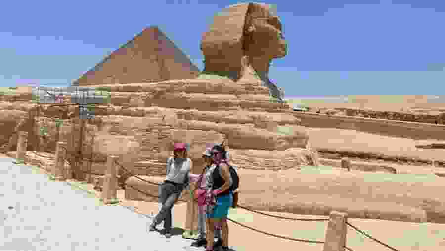 Travellers next to the Great Sphinx of Giza