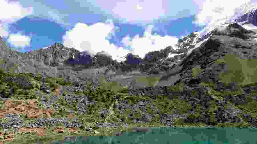 Visit Humantay, sits snugly between Humantay Mountain and Salkantay Mountain