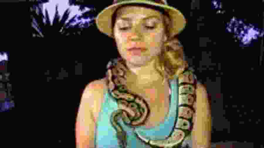 A Guest Holding a Python