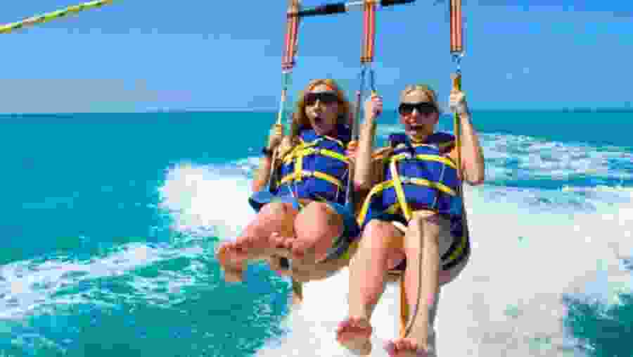 Travellers parasailing