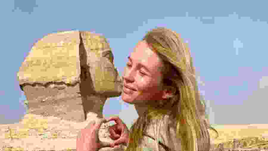 Travelers next to the Great Sphinx of Giza