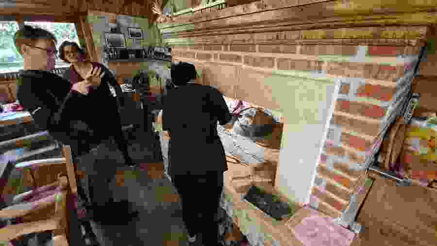 Preparing the meal in a brick oven