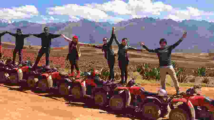 Tourists Posing with the Quad Bike