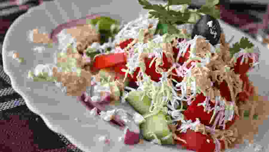 Enjoy a full platter of fruit salad with cheese