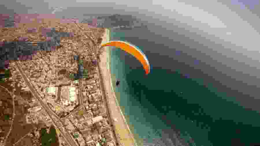 Travellers paragliding in Tandem