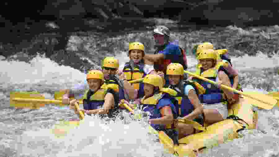 Tourists enjoying River Rafting