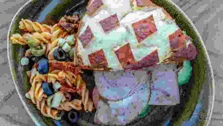 A vibrant spread of pasta, meats, and salads from the Geysir Glíma Restaurant