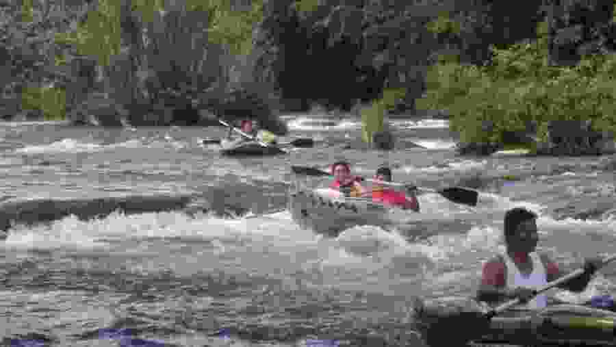 Kayak through River Rapids