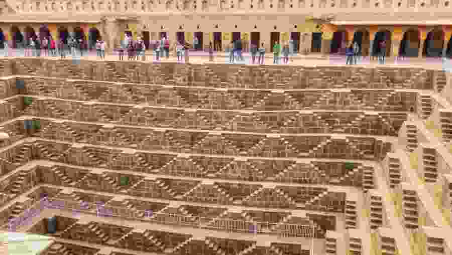 Our Tourist are watching Chand Baori with Guide.