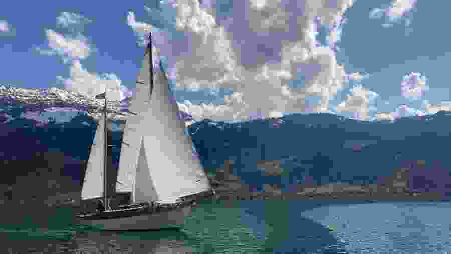 Sailing by snow-capped peaks