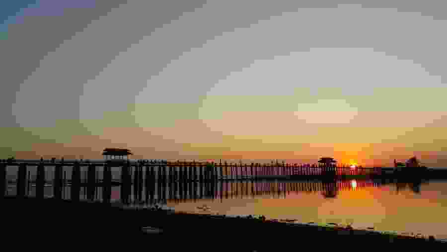 Sunset View from U Bein Bridge, a Pedestrian bridge in Mandalay, Myanmar