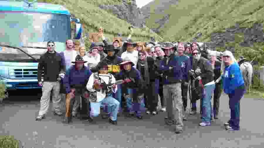 Tourists Posing infront of a Bus while being driven to the Quito Airport