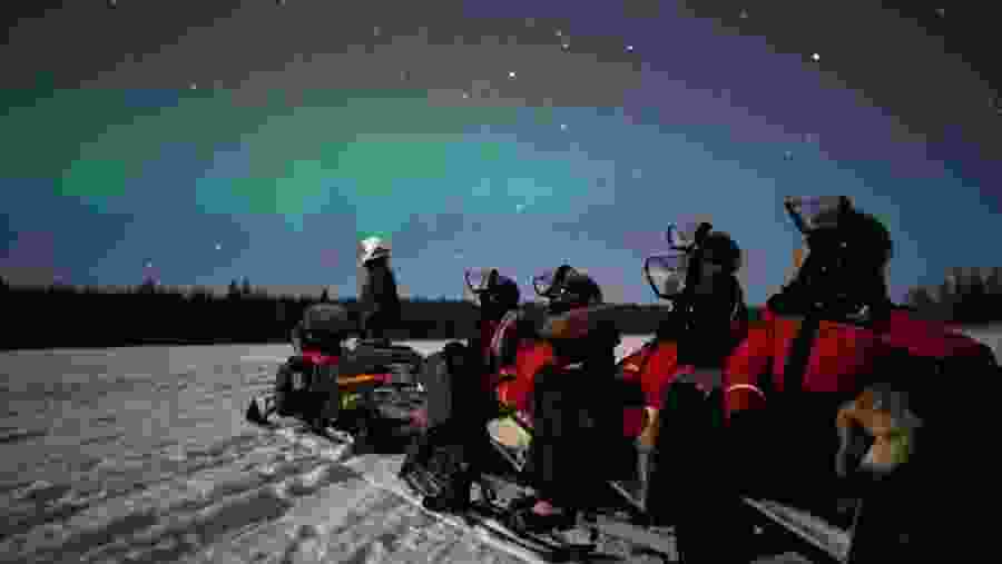 Northern Lights hunting and Snowmobiles