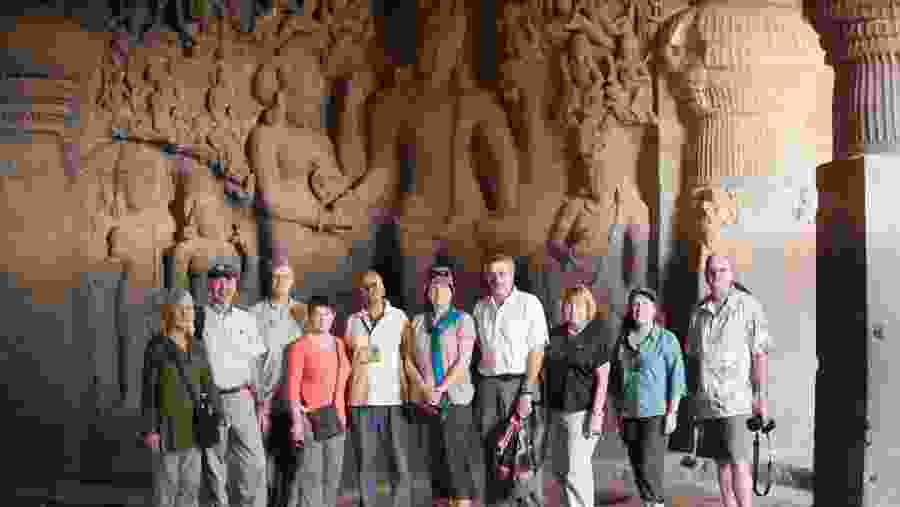 A group of American tourists touring the Ellora cavess, near