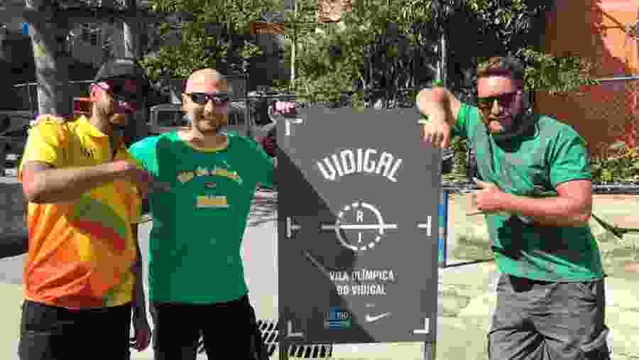 Visitors posing at the gate of Olympic Village park in Vidigal