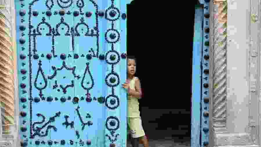 A kid in the blue city