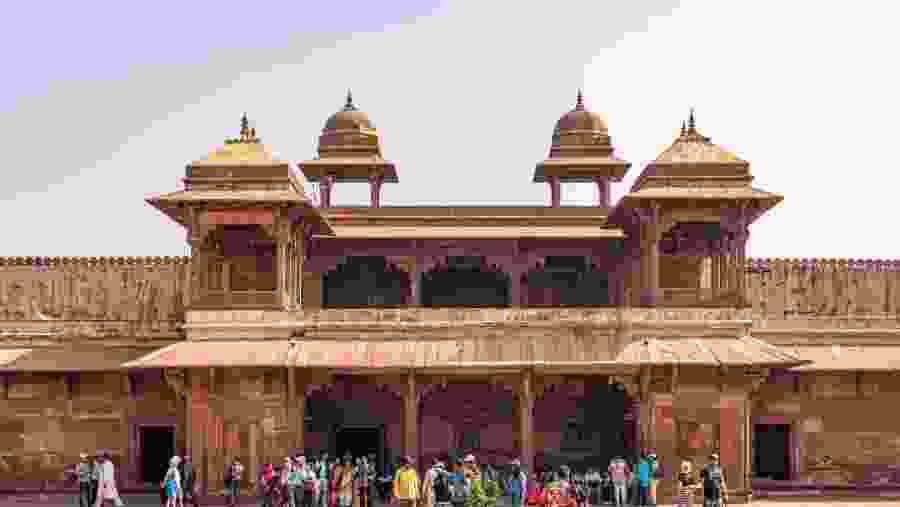 Tourists visiting Panch Mahal, Royal Palace in Fatehpur Sikri, City built by Great Mughal Emperor Akbar at late 16th century.