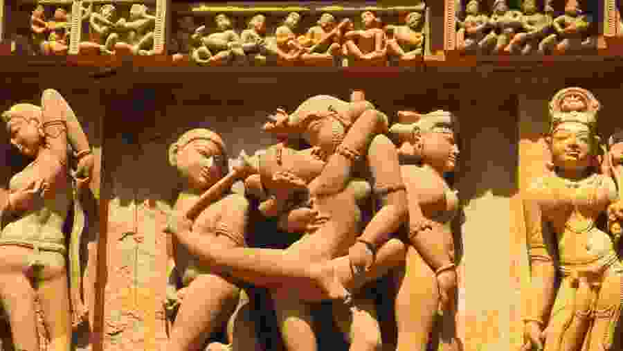 Stone carved erotic sculptures in Hindu temple in Khajuraho.