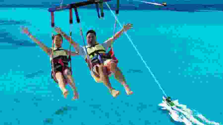 Travellers parasailing