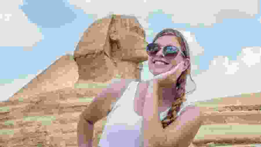 Travelers next to the Great Sphinx of Giza