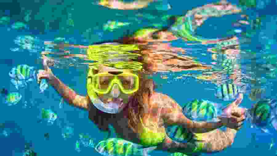 Happy Tourist enjoying snorkelling