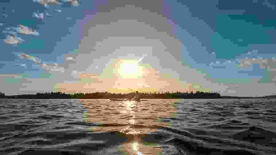 Paddle surfing on the Lake Under the Midnight Sun