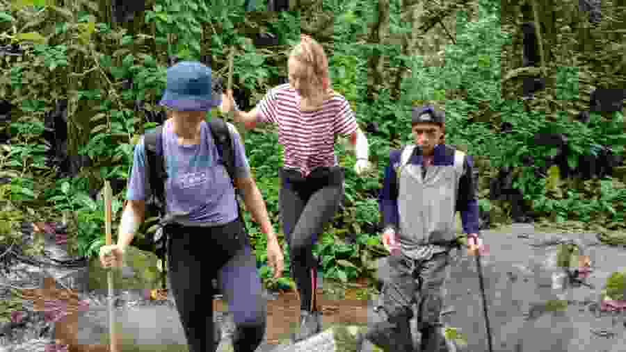 Crossing rivers on the hike to Meratus mountains
