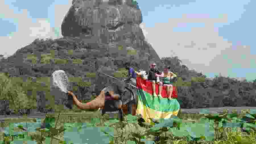 Tourists enjoying elephant ride