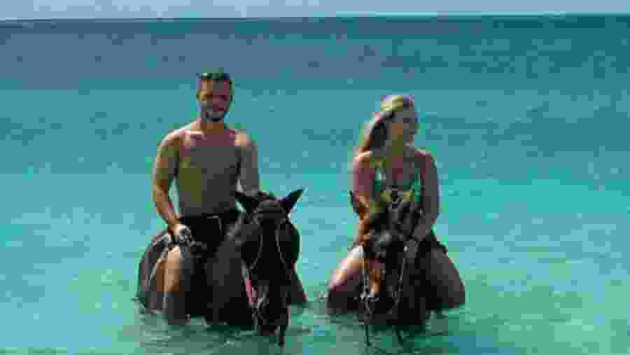 Couple enjoying horse riding