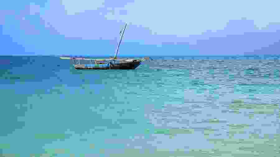 Dhow in the turquoise blue waters of Indian Ocean, Zanzibar