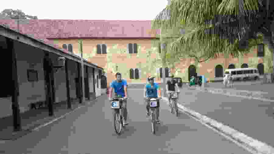 Tourists exploring areas in Galle on a bike.