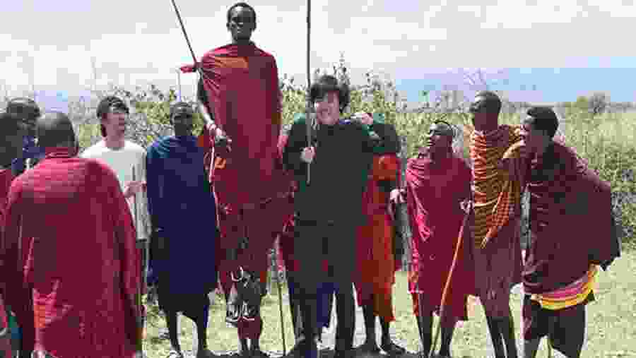 Happy Tourists With The Locals