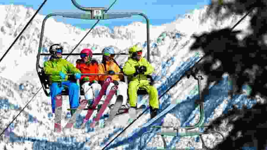 Ropeway over snow-covered mountains
