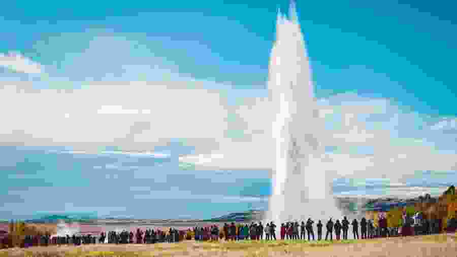 Strokkur erupting into the sky, see first hand the geothermal power of Iceland's landscape